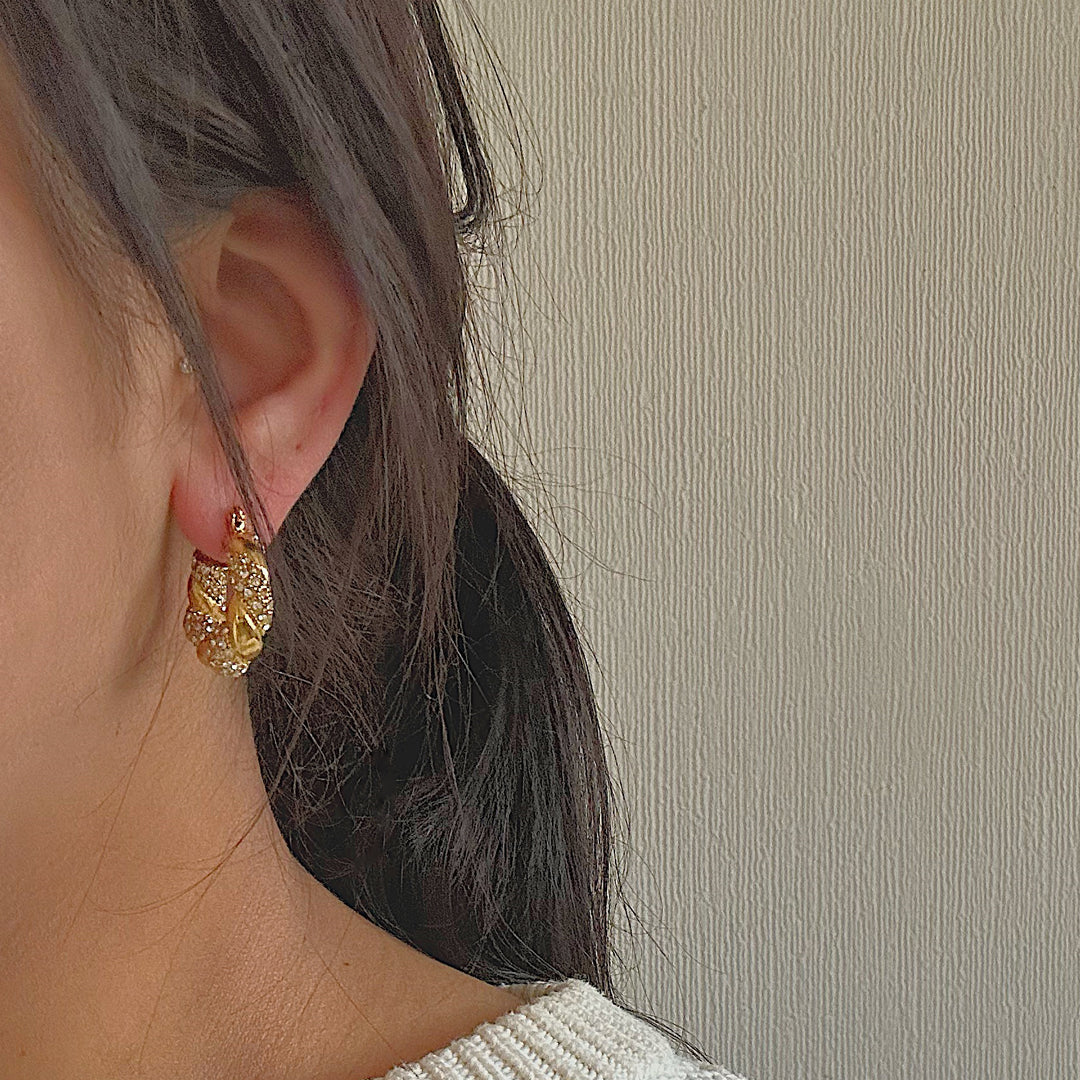 HOLLYWOOD. Gold Crystal Twist Croissant Hoop Earrings