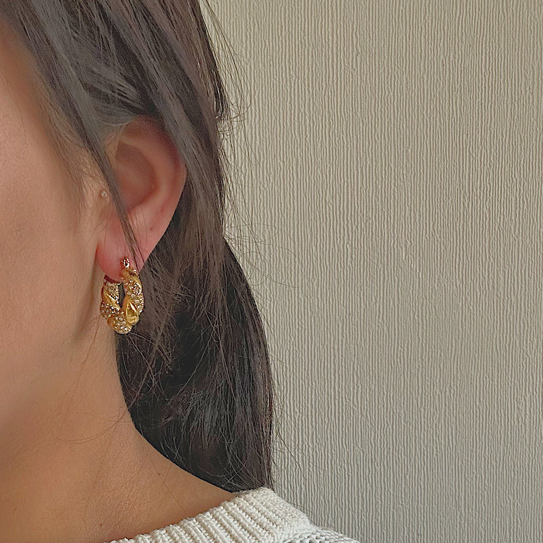 HOLLYWOOD. Gold Crystal Twist Croissant Hoop Earrings