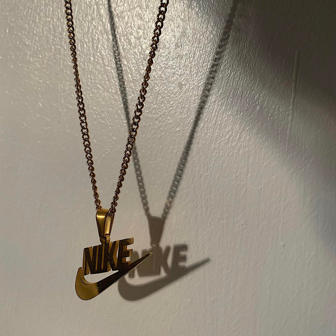 NIKE. Gold Swoosh Pendant Necklace IMPERFECT