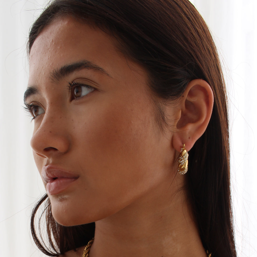 HOLLYWOOD. Gold Crystal Twist Croissant Hoop Earrings