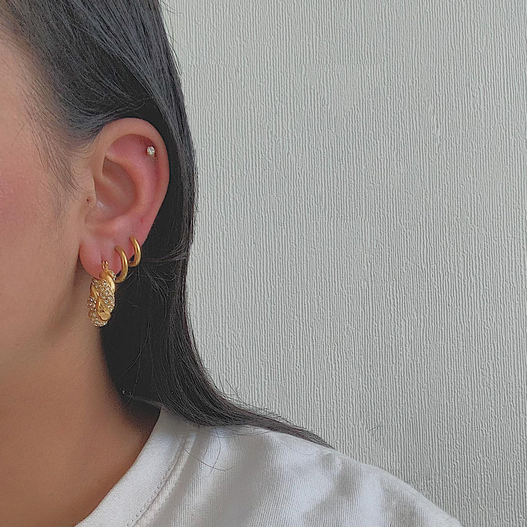 HOLLYWOOD. Gold Crystal Twist Croissant Hoop Earrings