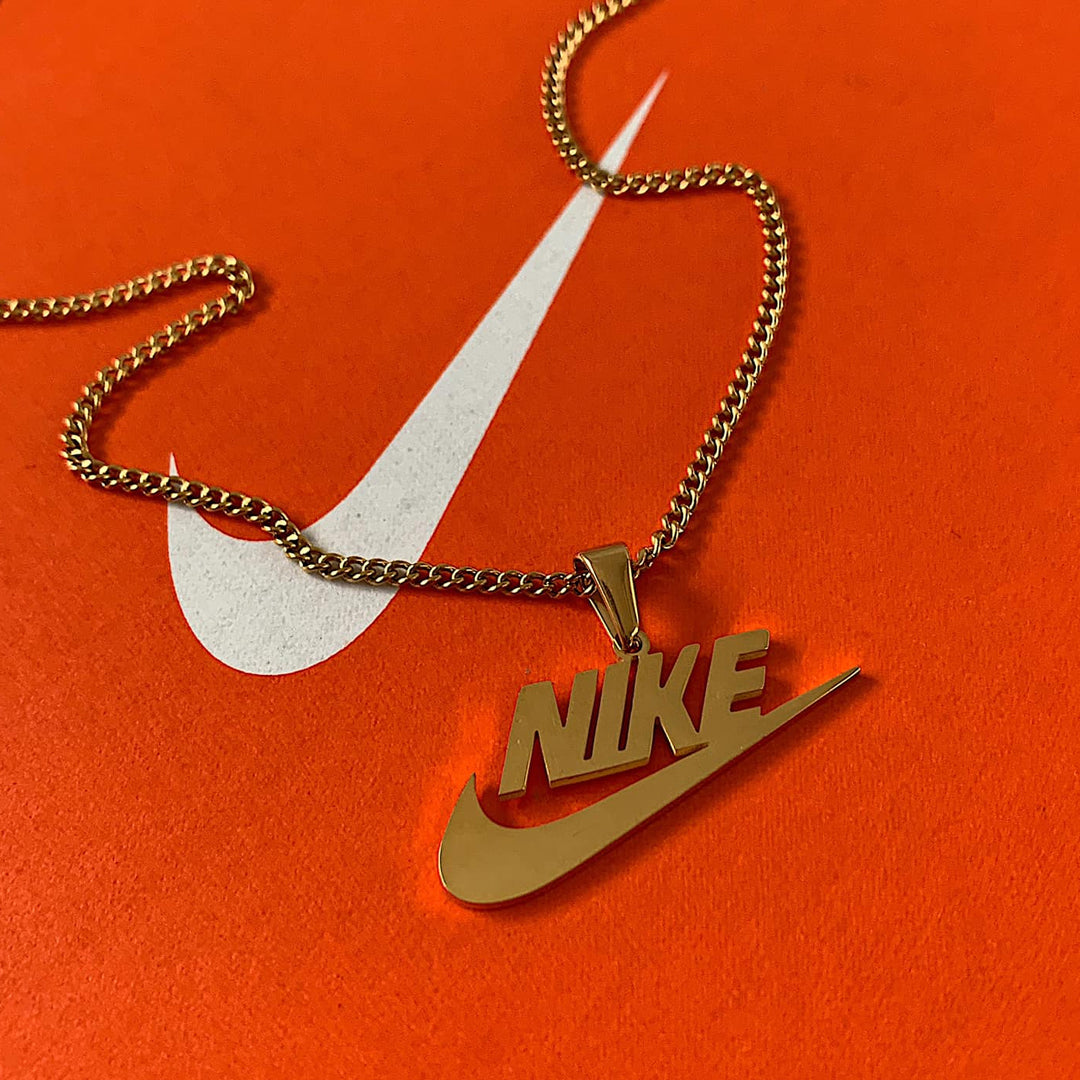 Gold nike swoosh outlet pendant