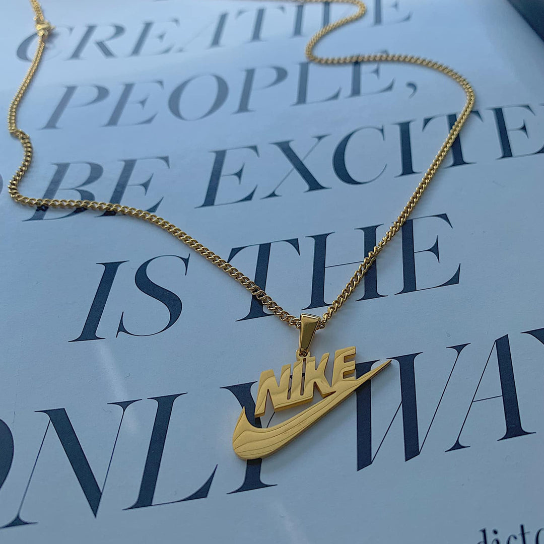 NIKE. Gold Swoosh Pendant Necklace