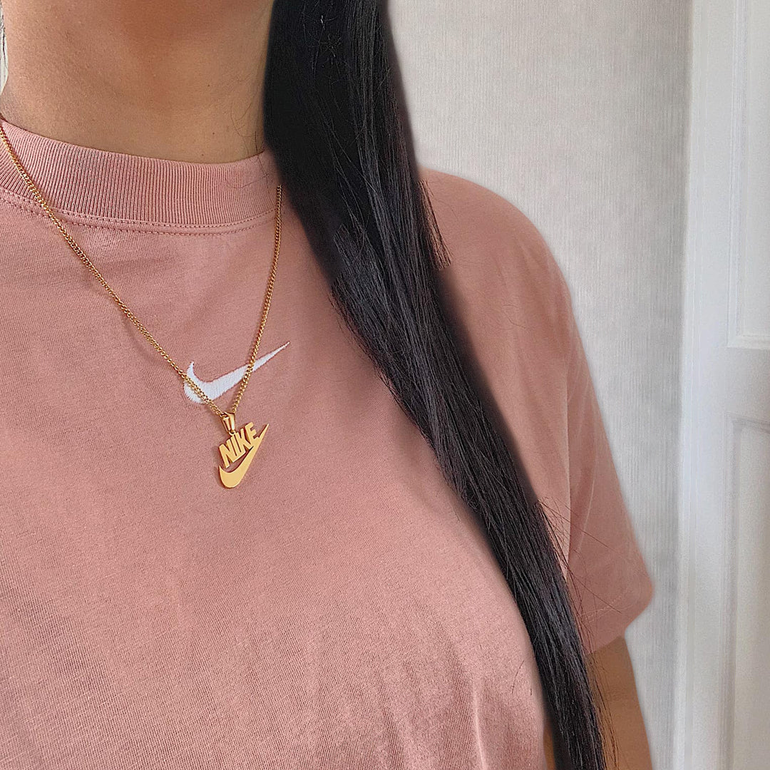 NIKE. Gold Swoosh Pendant Necklace