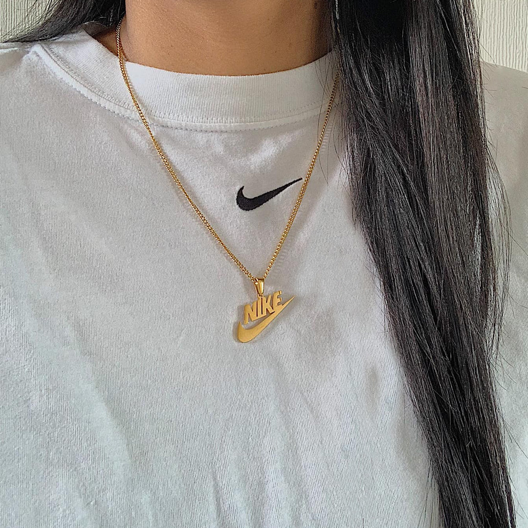 NIKE. Gold Swoosh Pendant Necklace