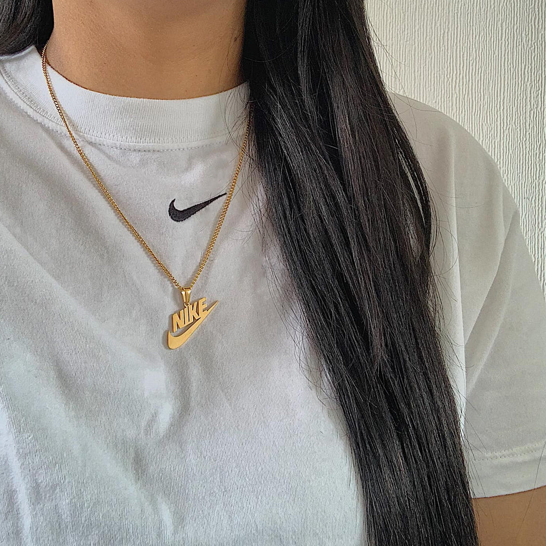 NIKE. Gold Swoosh Pendant Necklace Westwood and Hyde