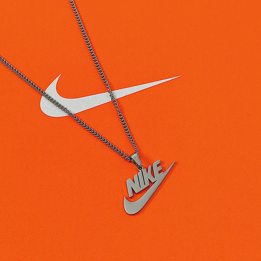 NIKE. Gold and Silver Swoosh Pendant Necklace Set