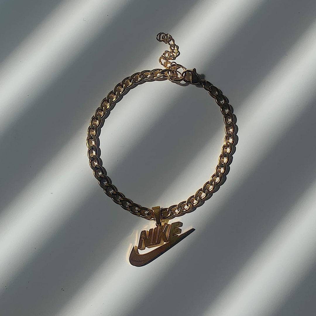 NIKE. Gold and Silver Swoosh Pendant Anklet Set